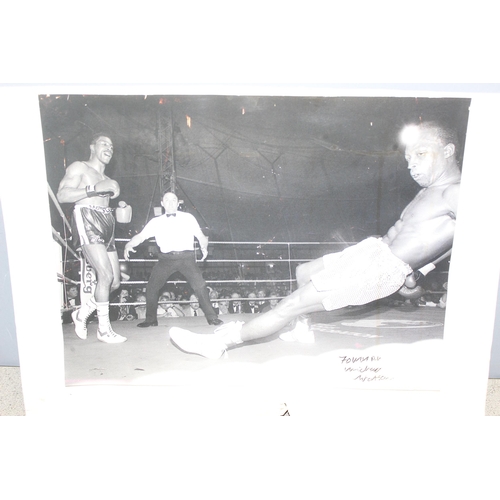 733 - A signed photograph of Michael Watson on card backing, and a 1991 Eubank Watson fight programme (2)