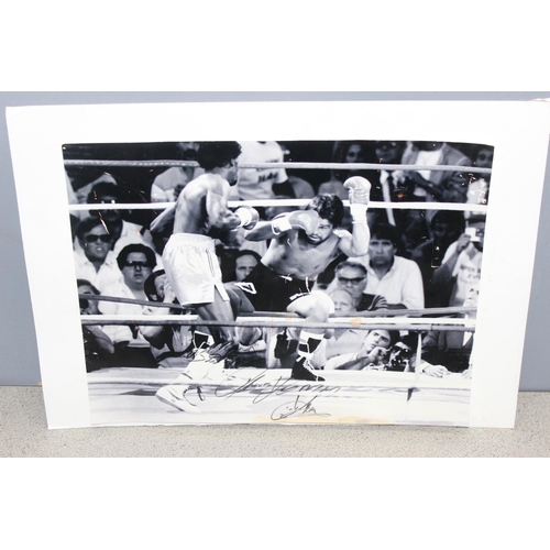 734 - A signed photograph of Tommy Hearns and Roberto Duran and various other boxing programmes and epheme... 