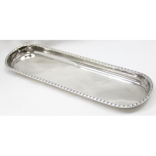 1002 - A small heavy gauge silver dressing table trinket tray, London 1911 by Elkington & Co, approx 22cm w... 