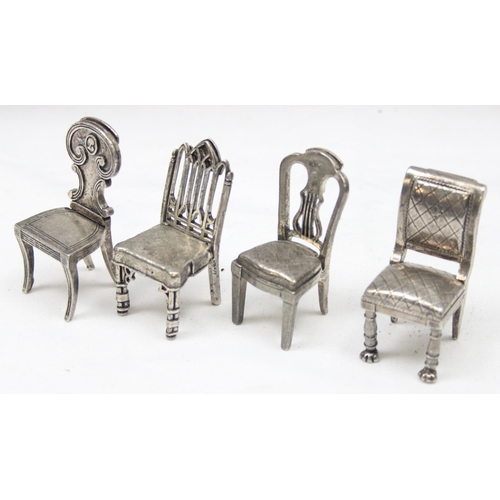 1035 - A set of 8 assorted vintage silver plated menu or place card holders formed as antique chairs to inc... 