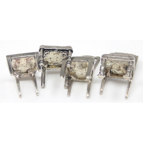 1035 - A set of 8 assorted vintage silver plated menu or place card holders formed as antique chairs to inc... 