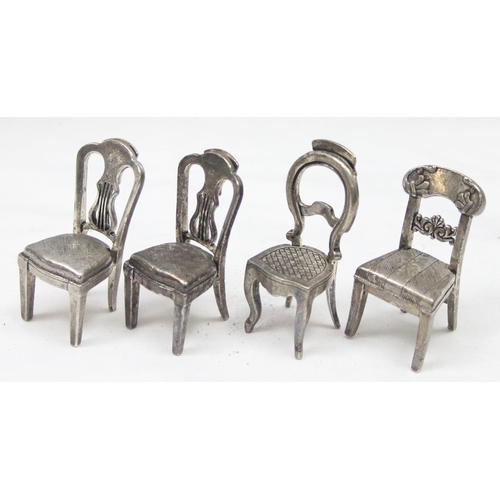 1035 - A set of 8 assorted vintage silver plated menu or place card holders formed as antique chairs to inc... 