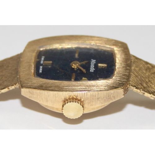 1318 - A vintage 18ct gold Nivada Swiss made watch, the retro bark effect strap and case marked 750 and wit... 