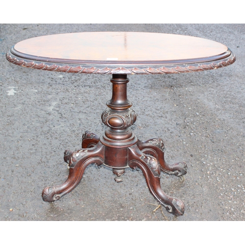 169 - A 19th century walnut side table with carved rope twist edge, carved tripod base and 4 legs, approx ... 