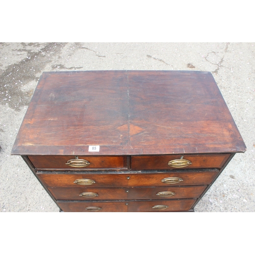 85 - An 18th century 2 over 3 chest of drawers, believed to be walnut with cross banded detail and oak ca... 