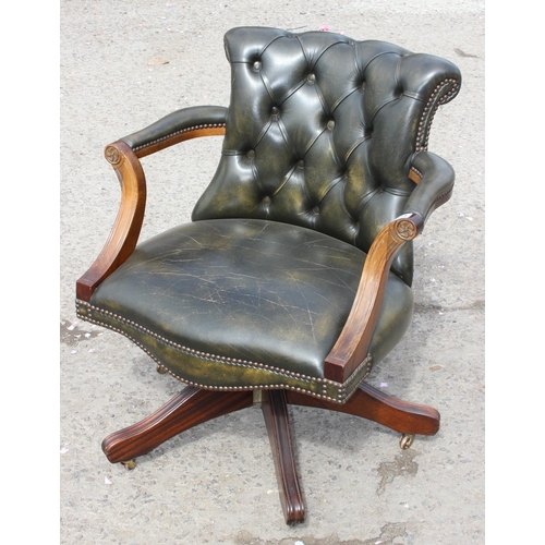 114 - Gainsborough style captain's chair with rich green leather chesterfield upholstery