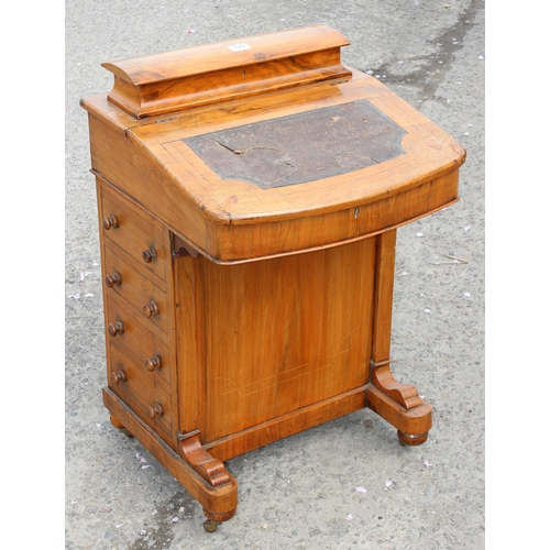 129 - A 19th century walnut Davenport desk with leather inset top and 4 drawers to one side and 4 false dr... 