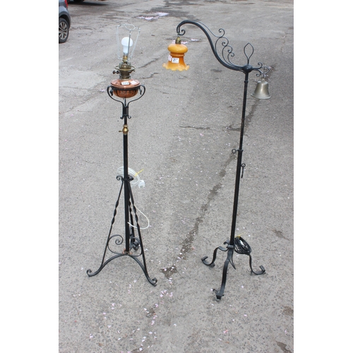 257 - 2 antique style wrought iron standard lamps both in the manner of WAS Benson, one a converted oil la... 