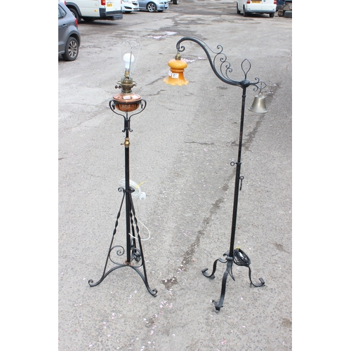 257 - 2 antique style wrought iron standard lamps both in the manner of WAS Benson, one a converted oil la... 