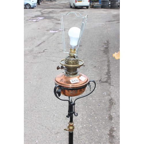 257 - 2 antique style wrought iron standard lamps both in the manner of WAS Benson, one a converted oil la... 