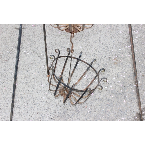 327 - 2 wirework flower baskets, approx 84cm wide x 140cm tall