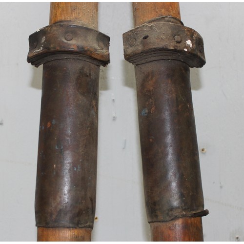 726 - A pair of vintage wooden rowing oars, each approx 234cm long