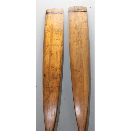 726 - A pair of vintage wooden rowing oars, each approx 234cm long