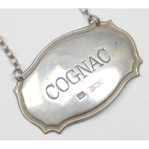 1099T - Silver Cognac decanter label, Birmingham 1987 by Alan M Weisrose, approx 8.79g gross