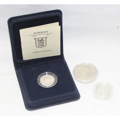 1250i - 3 silver coins to inc a 1993 Alderney £1, 1977 Guernsey £1 and a 1989 Chinese coin, all XRF confirme... 