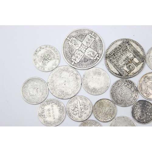 1204 - Qty of assorted mixed world and British silver coins to inc an 1883 Gothic Florin, approx 54.15g gro... 