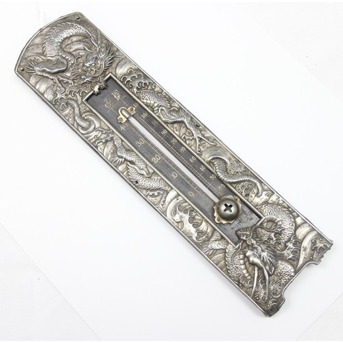 1005 - An unusual early 20th century silver plated thermometer decorated with embossed Chinese dragons, see... 