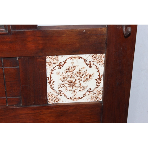 12 - A vintage oak hall stand with mirror, tiles and glove box, approx 84cm wide x 31cm x 195cm tall