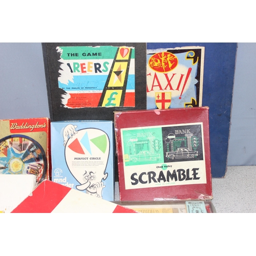 1502 - A large qty of assorted vintage and later toys and games to inc Monopoly, Scrabble, Taxi, Dover Patr... 