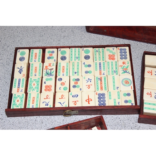 1505 - A vintage bone and bamboo Mahjong set in wooden case with a boxed set of tile holders