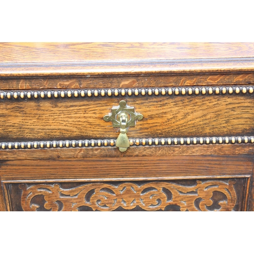 16 - An antique oak sideboard of Jacobean style with barleytwist supports, approx 121cm wide x 47cm deep ... 