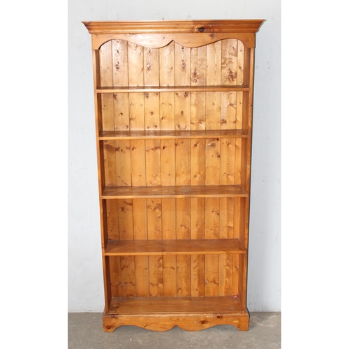 19 - A large pine bookshelf, approx 94cm wide x 26cm deep x 184cm tall