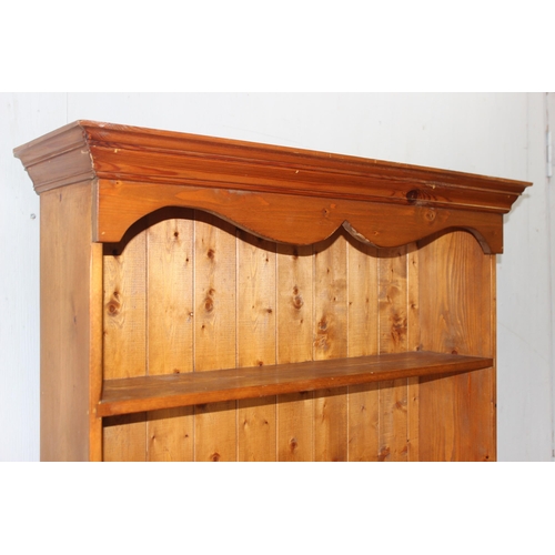 19 - A large pine bookshelf, approx 94cm wide x 26cm deep x 184cm tall