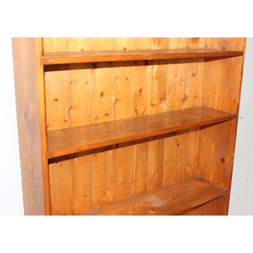 19 - A large pine bookshelf, approx 94cm wide x 26cm deep x 184cm tall