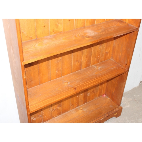 19 - A large pine bookshelf, approx 94cm wide x 26cm deep x 184cm tall