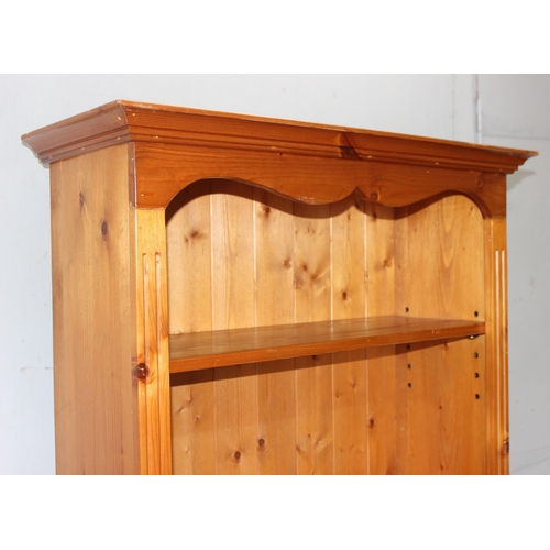 20 - A large pine bookshelf, approx 81cm wide x 33cm deep x 182cm tall