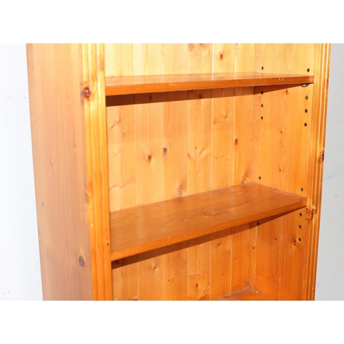 20 - A large pine bookshelf, approx 81cm wide x 33cm deep x 182cm tall