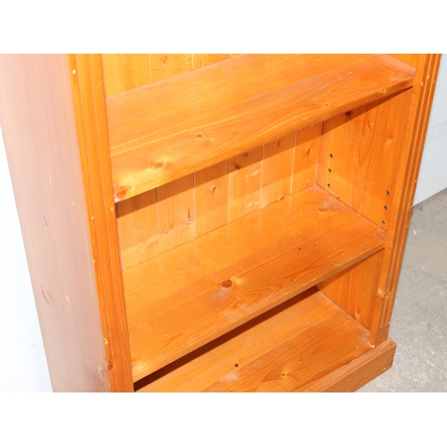 20 - A large pine bookshelf, approx 81cm wide x 33cm deep x 182cm tall