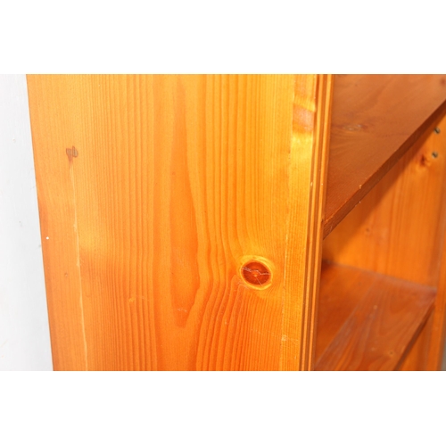 20 - A large pine bookshelf, approx 81cm wide x 33cm deep x 182cm tall