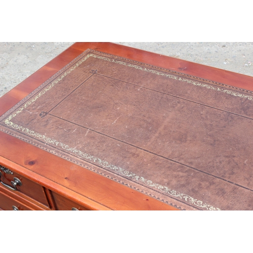 22 - A modern pedestal 3 part desk with red leather inset top, approx 122cm wide x 61cm deep x 78cm tall