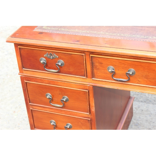 22 - A modern pedestal 3 part desk with red leather inset top, approx 122cm wide x 61cm deep x 78cm tall