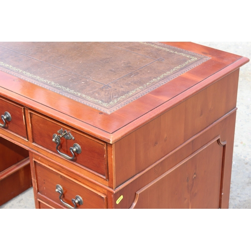 22 - A modern pedestal 3 part desk with red leather inset top, approx 122cm wide x 61cm deep x 78cm tall