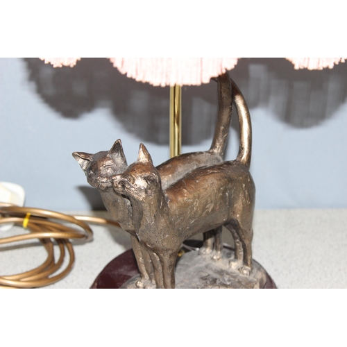 230 - A bronzed finish cat table lamp with shade, approx 53cm tall