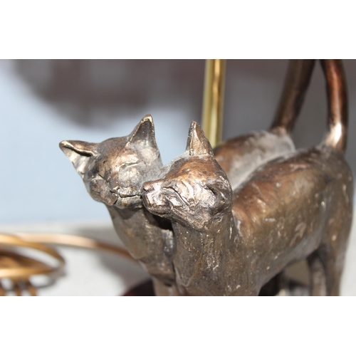 230 - A bronzed finish cat table lamp with shade, approx 53cm tall