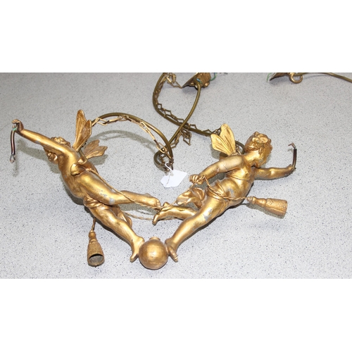 235 - 2 gilt metal hanging cherub light fittings, one a double and a single, largest approx 42cm wide x 75... 