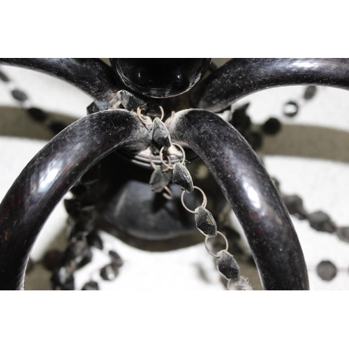 242 - Black chandelier with moulded glass body and beaded decoration, approx 41cm H