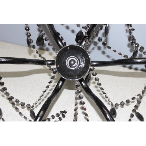 242 - Black chandelier with moulded glass body and beaded decoration, approx 41cm H