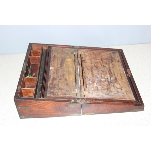 272 - An antique mahogany writing slope with brass bound corners, approx 40cm wide