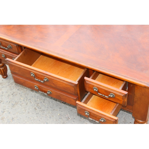 28 - A good quality modern mahogany coffee table, approx 122cm wide x 70cm deep x 48cm tall