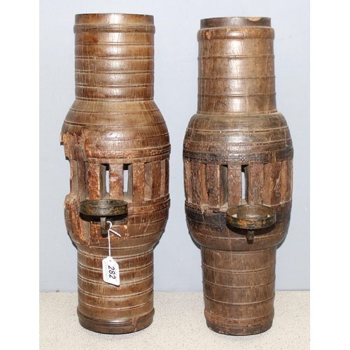 282 - Pair of heavy carved wood candle wall sconces formed from cartwheel hubs, approx 52cm