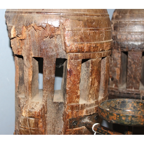 282 - Pair of heavy carved wood candle wall sconces formed from cartwheel hubs, approx 52cm