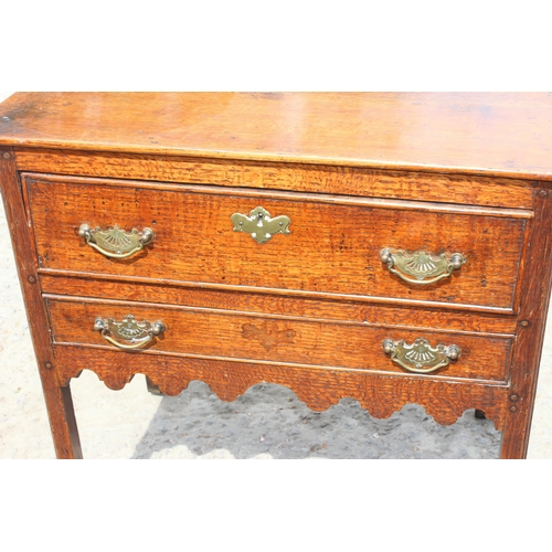 4 - A Georgian 2 drawer oak lowboy with brass fittings, likely 2nd half 18th century, approx 74cm wide x... 