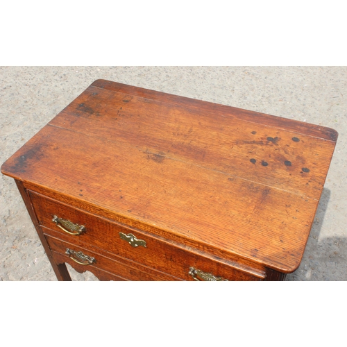 4 - A Georgian 2 drawer oak lowboy with brass fittings, likely 2nd half 18th century, approx 74cm wide x... 