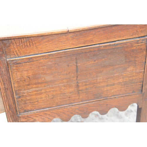 4 - A Georgian 2 drawer oak lowboy with brass fittings, likely 2nd half 18th century, approx 74cm wide x... 