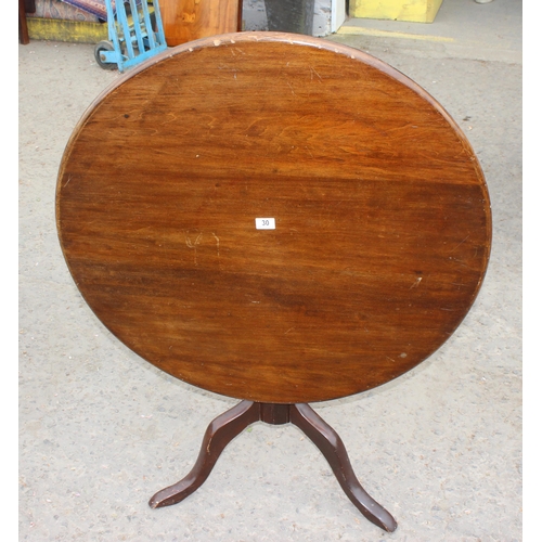 30 - An antique mahogany tilt topped table with tripod base, approx 89cm diameter x 74cm tall