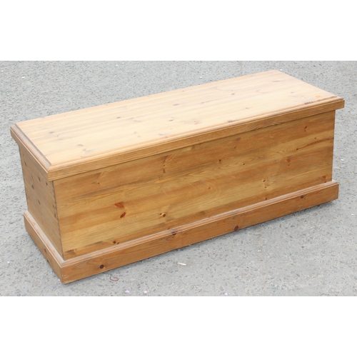 53 - A large vintage pine ottoman or blanket box, approx 123cm wide x 46cm deep x 48cm tall